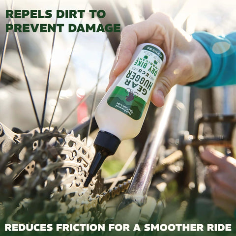 Hand applying Plant Powered Bike Chain Lubricant 3.2 Oz Pack Of 1, Eco Friendly No Teflon No Petroleum No PTFE to bicycle chain