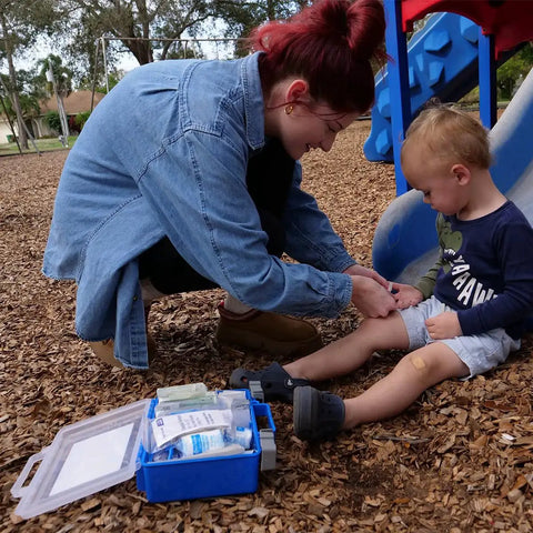 OSHA Compliant First Aid Kit For 50 People With 260 Pieces All Purpose Emergency Supplies for treating child at park