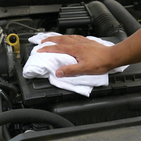 Hand using Premium White T Shirt Cleaning Rags For Cleaning Staining Painting And More In A 2x25 Lb Compressed Box White Cotton Cloths For Spills Dust Oil Grease And Wood Finish Polishing Eco Friendly Reusable to clean a car engine