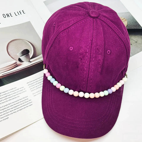 Detachable Pearl Hat Chains For Trucker Hats And Mesh Baseball Caps with colorful beads on a purple cap.