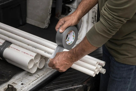 Person using Duct Tape 1.88 Inch By 60 Yard Silver For Quick Repairs And Sealing on PVC pipes