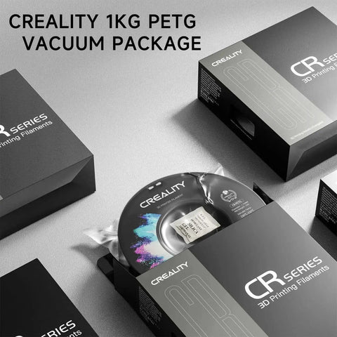 Creality 1kg PETG spool vacuum packaged for 3D printing, black color, with box labeled 'CR Series 3D Printing Filaments'.