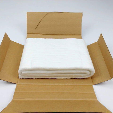 Ceramic fiber insulation blanket, 1/4 inch thick, white, folded inside an open cardboard box