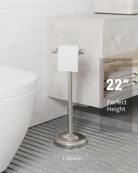 Free Standing Toilet Paper Holder With Pivoting Post, Brushed Nickel Finish, next to bathroom wall, measures 22 inches, supports mega roll