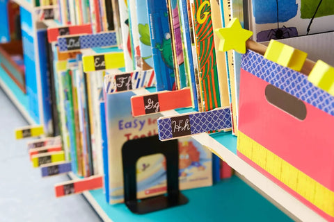 Library books with colorful index tabs, featuring black stripe washi craft tape, 6-roll pack, 0.59 in x 393 in adhesive decorative paper masking tape.