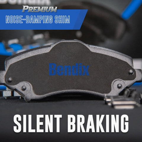 Bendix Premium SBC1084 ceramic front brake pad, black with blue Bendix logo, front view.