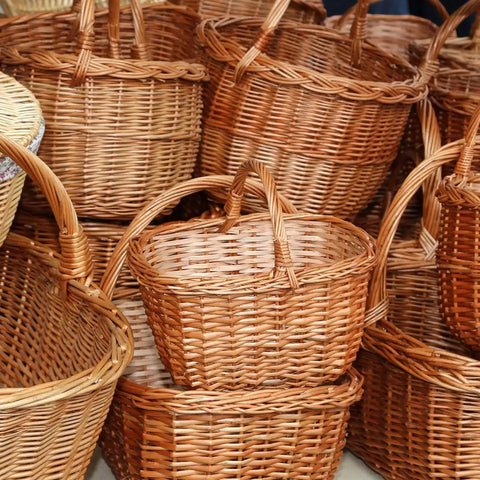 Wicker baskets crafted with Round Reed Spline 350 Ft Roll 0.14 Inch for DIY furniture and basket weaving projects.
