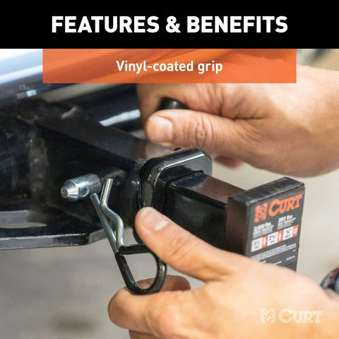 Hands securing Trailer Hitch Pin and Clip With Vinyl Coated Grip, Half Inch Diameter, Fits One And One Quarter Inch Receiver