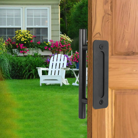 12 Inch Sliding Barn Door Handle Pull With Flush Back Plate, Matte Black Powder Coated Finish, installed on wood door, garden view