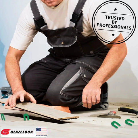 Installer using multipack horseshoe shims 400 pcs U shape tile spacers for leveling floors during a tile installation