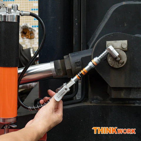 Using Grease Gun Coupler Set With Double Handle For Extra Reach And 90 Degree Adaptor One Eighth NPT Fittings On Machinery