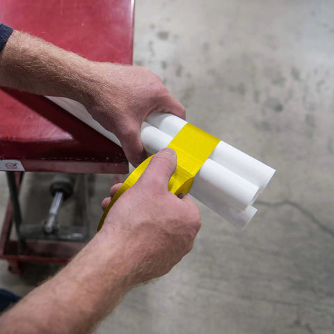 Person wrapping pipes with Multi-Purpose Duct Tape 3900 Yellow: General Purpose Rubber Adhesive, Water Resistant Cloth-Backed
