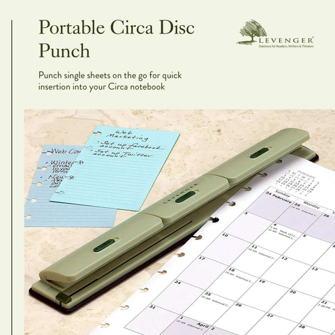 Circa 1 2 3 Portable Discbound Hole Punch Ultra Lightweight Mini Paper Puncher on notebook with punched pages