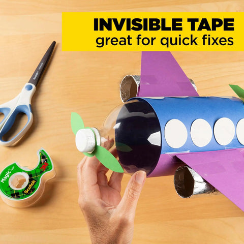 Hand crafting airplane model using Invisible Magic Tape 4-Pack Refill Rolls 0.75 in x 1000 in, shows matte finish office supply.