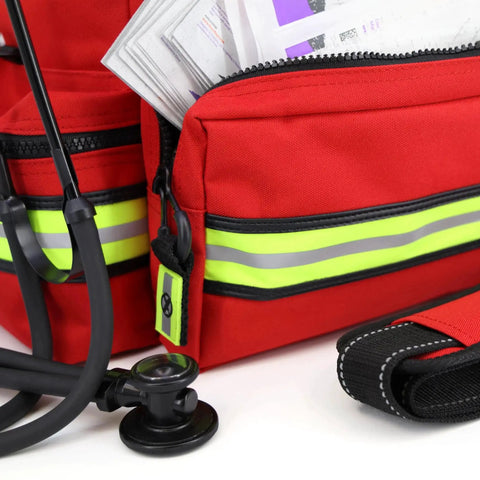 Close-up of Mid Sized First Responder EMT Bag Fully Stocked With Over 240 First Aid EMS And Trauma Supplies, featuring red fabric and reflective strips.