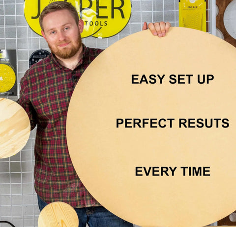 Man holding a large round wooden board with "EASY SET UP, PERFECT RESULTS, EVERY TIME" text, next to smaller round boards.