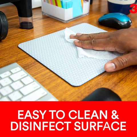 Hand cleaning Precise Mouse Pad With Repositionable Adhesive Back For Optical Mice At High Speeds on wooden desk