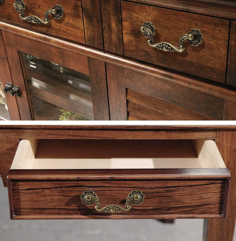 Six Piece Set Of Vintage Drop Bail Drawer Pulls In Antique Bronze Finish installed on wooden cabinet drawers