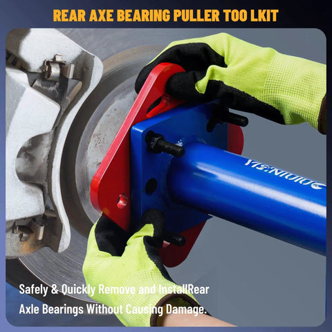 Individual using rear axle bearing puller and installer with ABS tone ring tool adapter plate on Toyota truck for axle service.