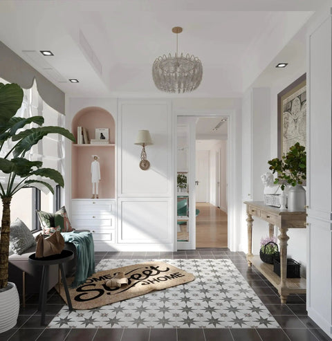 Stylish entryway with decorative chandelier, plants, and open sliding door leading to a bright room.