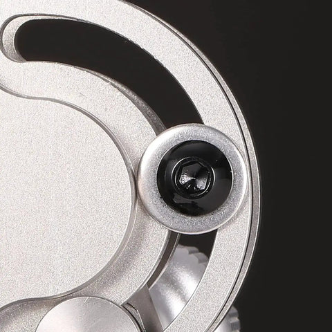 Close-up of One Quarter Twenty Button Head Socket Cap Bolts Set showing black oxide finish and hex drive on stainless steel surface.