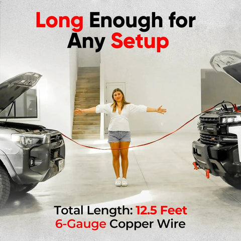 Person standing between two cars with Illumi Heavy Duty Jumper Cables Kit for Cars and Trucks with 12Ft 6 Gauge Copper Wires.