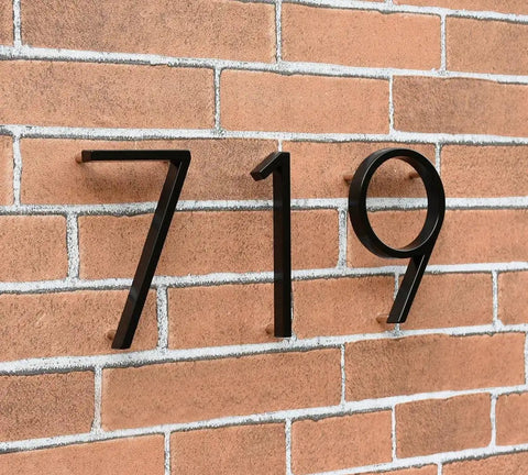 5 Inch Stainless Steel Floating House Number With Nail Kit Coated Black 911 Sign installed on brick wall