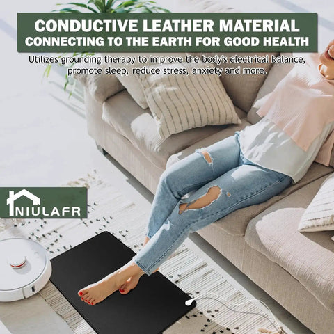 Woman relaxing on beige sofa with All In One Grounding Mat Kit With 15Ft Cord for foot mats computer desk and sleep mat on floor