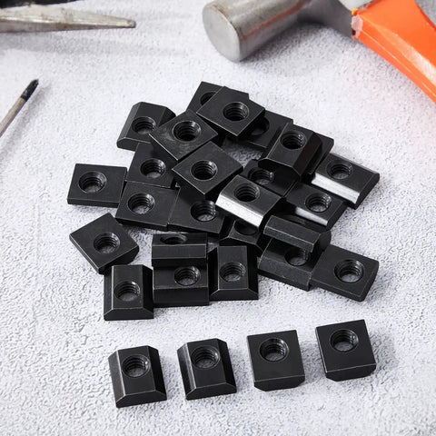 Pile of Bulk Pack Of 100 Slide In T Nuts 15 Series Five Sixteenths By Eighteen UNC Threaded Steel T Nuts For Aluminum Extrusion