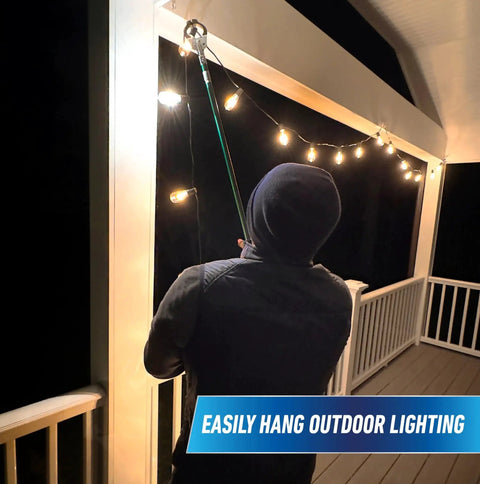 Person using 36 Inch Nifty Nabber Reacher Grabber Tool For Easy Yard Cleanup And Trash Pickup With Built In Magnet And Ergonomic Grip to hang lights
