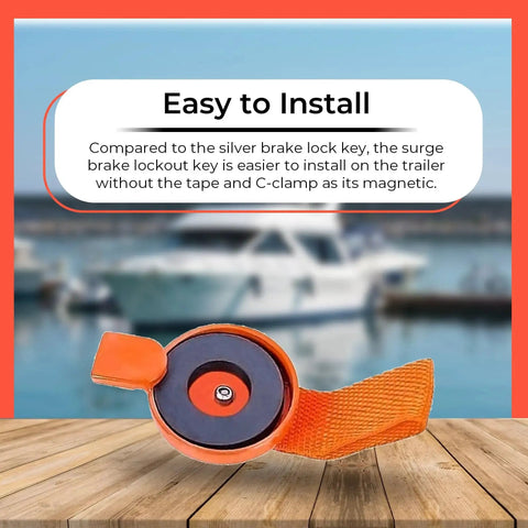 Orange surge brake lockout key with magnetic disc and heavy-duty strap for UFP boat trailer