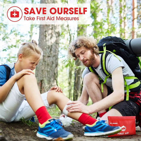 Man treating boy's injured knee with Compact 87 Piece Travel First Aid Kit For Home, Car, Camping, Outdoors And Work.