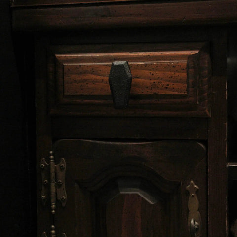 Gothic Black Cast Iron Coffin Drawer Pull on dark wooden drawer, part of a durable 6-piece set for gothic style cabinets and drawers
