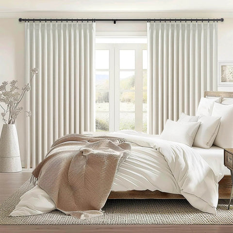 96 Inch Long Natural Pinch Pleated Blackout Curtains With Thermal Insulation And Linen Look One Panel 72W By 96L Inches Boss Level Light Blocking For Large Living Room Windows Track System Drapes For Bedroom Privacy And Noise Reduction in a bright bedroom setting.