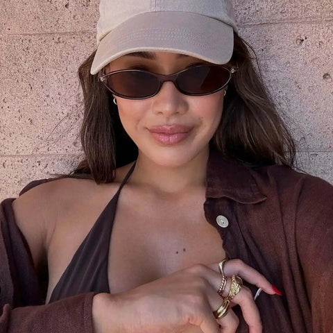 Woman wearing Retro Oval Sunglasses For Women With Cat Eye 90s Vibe Lightweight Narrow Frames UV Protection Sun Glasses
