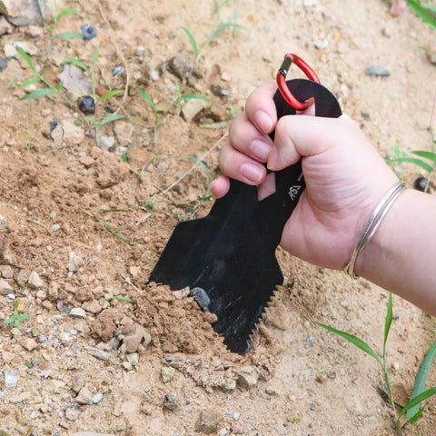 Person using Ultralight Backpacking Trowel With Longer Handle Aluminum Camping Shovel For Hiking Outdoor Travel And Survival