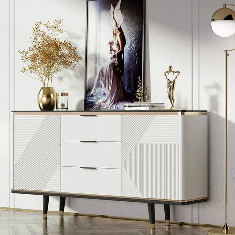 Modern white credenza with decorative accessories in a contemporary living room setup.
