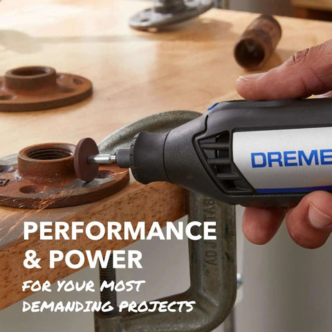 Hand using Dremel rotary tool for sanding rusted metal surface on workbench, showcasing variable speed from 5000 to 35000 RPM