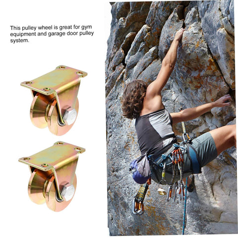 Beefy Two Pack Heavy Duty Sliding Door Pulley Block with Steel Wheel next to climber on rock face, for gates and shutters.