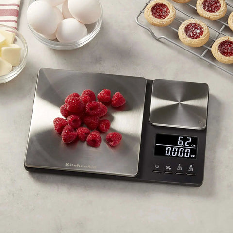 Dual Platform Digital Kitchen Scale for Home Chefs with raspberries on stainless steel surface, 11 lb and 16 oz capacity, backlit LCD.