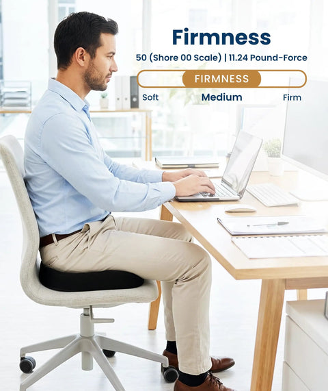 Person sitting on a Doctor Recommended Memory Foam Seat Cushion For Office Chairs And Cars, Ergonomic Tailbone Pain Relief, Sciatica Support in an office.