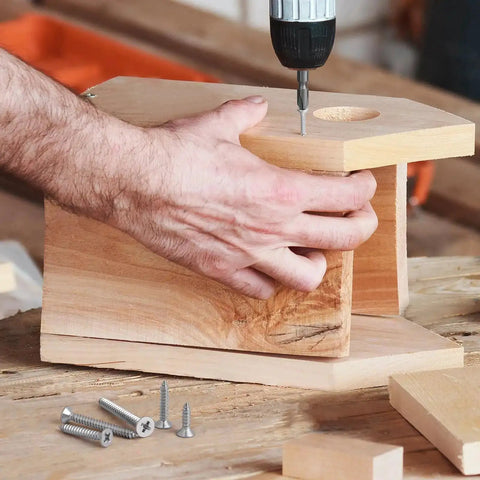 Person using 304 stainless steel Phillips drive wood screws from 210 piece assortment kit for DIY wood project assembly.