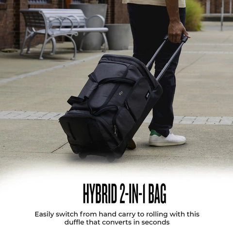 Person pulling Go-To Rolling Duffle For Travel With Wheels 49L Capacity Carry-On Ready At 12 X 22 X 12 Inches Solo New York Leroy Gray