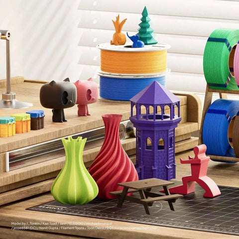 3D printed models with vibrant colors, including a purple tower, made using Pink PLA Filament With Reusable Spool 1kg 1.75mm For 3D Printing.