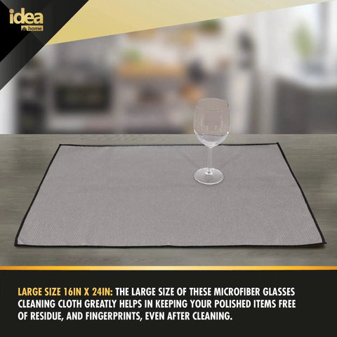 Premium Microfiber Cleaning Cloth 16x24 Ultra Absorbent Streak Free Pack of 2 shown with a glass on top, displaying its large size.