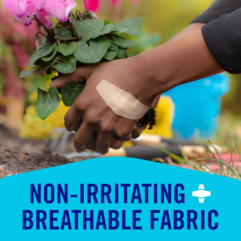 Close-up of hand wearing Painless-Removal Bandage during gardening, focus on breathable fabric and strong adhesive.