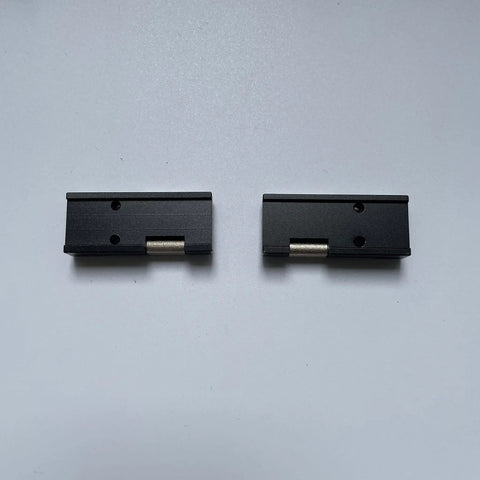 Fujikura 12 Core Ribbon Fiber Holder Chucking Jigs FH-60-12, black durable replacement sheath clamps, two pieces on white background.