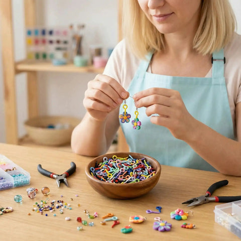 Woman making jewelry with 600 Piece Mixed Color Mini Screw Eye Pins For Jewelry Making And DIY Crafts, tools and beads on table.