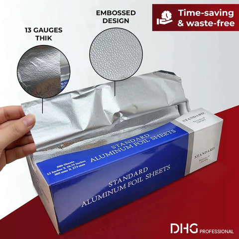 Hand pulling Heavy Duty Pre-Cut Aluminum Foil Sheets 12 x 10.75 Inches With Pop Up Dispenser For Easy Tear, showing embossed design and thickness.