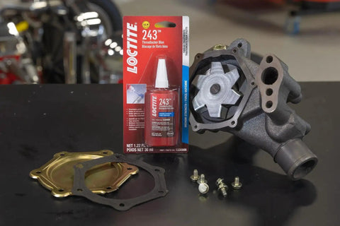 Medium Strength Surface Insensitive Threadlocker For 1/4 To 3/4 Inch Fasteners on a table with automotive parts